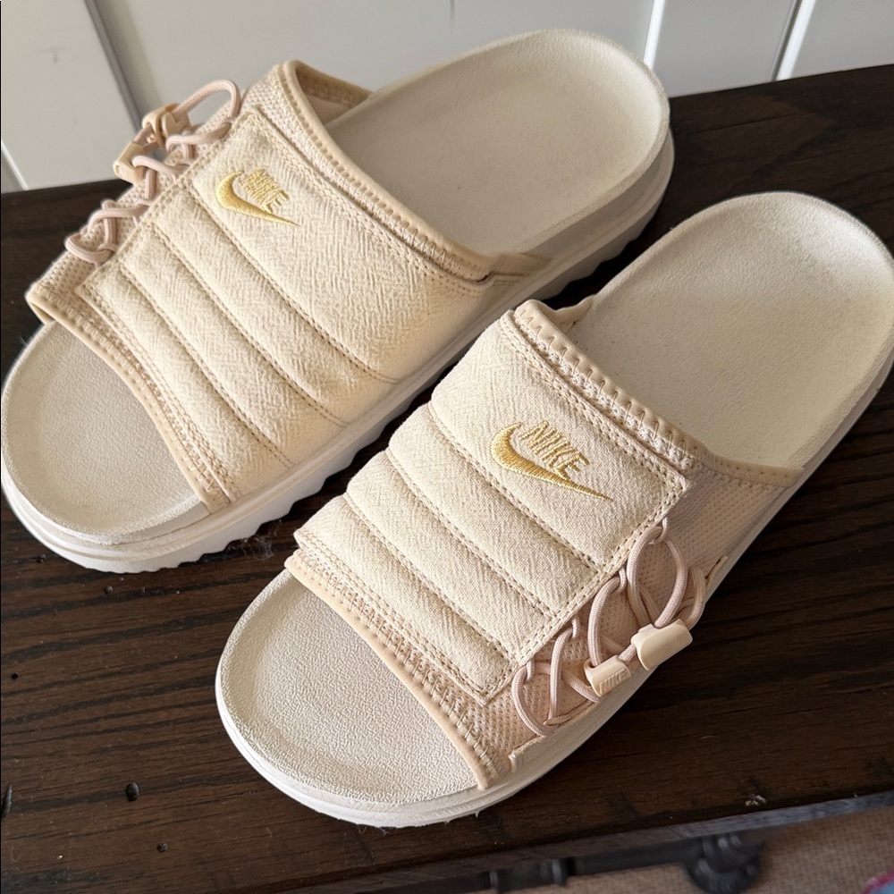 Nike Cream Slide Sandals with Gold Logo